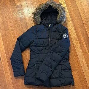 Quilted winter jacket with detachable fur hood embellishment. Fleece lined.